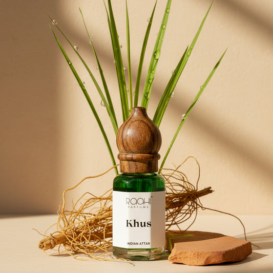 Green glass bottle with wooden stopper labeled khush by raahi parfums containing authentic handcrafted khus attar
