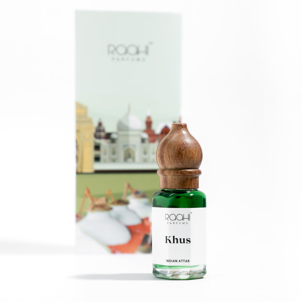 Green glass bottle with wooden stopper containing khus indian attar by roohi parfums handcrafted in kannauj