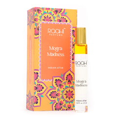 A sleek white roll-on bottle with gold cap containing golden-yellow mogra madness Indian attar by roahi parfums 12ml