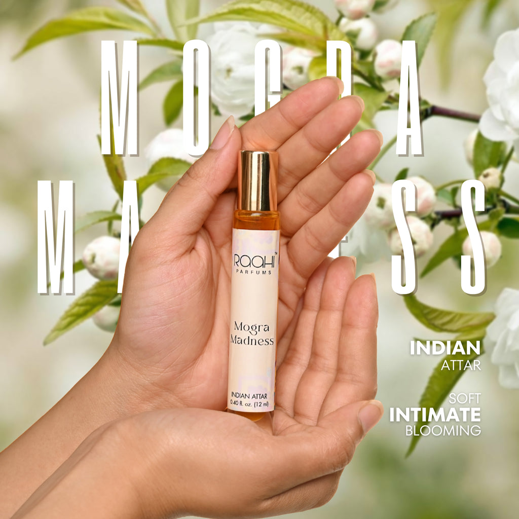 A sleek cylindrical roll-on perfume bottle with gold cap and white label for mogra madness indian attar 12ml