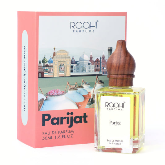 A clear glass bottle of raahi parfums parijat eau de parfum 50ml with wooden stopper and golden yellow liquid