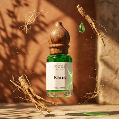 Green glass bottle with wooden stopper labeled khus indian attar by roahi parfums authentic handcrafted in kannauj