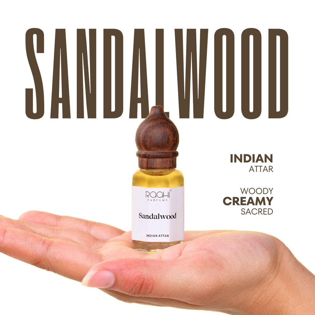 A small clear glass bottle with dark brown wooden stopper containing golden-yellow sandalwood attar handcrafted in Kannauj