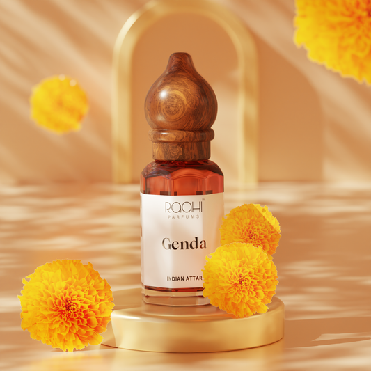 A sleek amber glass bottle with a polished wooden stopper labeled genda indian attar by raahi parfums handcrafted fragrance