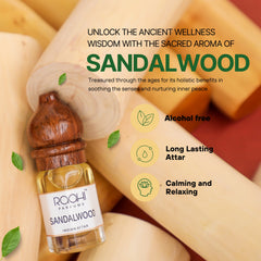 A small glass bottle of roahi parfums sandalwood indian attar with a dark brown wooden cap and label handcrafted in Kannauj